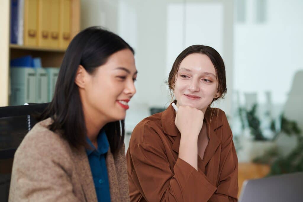 Businesswoman Looking at Talented Colleague