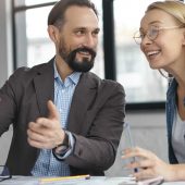 Hard working talented businessman explains financial analysis to his potential investor during busin